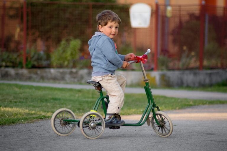 An illustration of the evolution of tricycles over time, starting from a classic vintage design to a modern and sleek version.