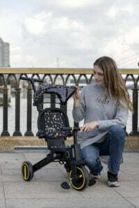 Newtronx tricycle with mom pushing child