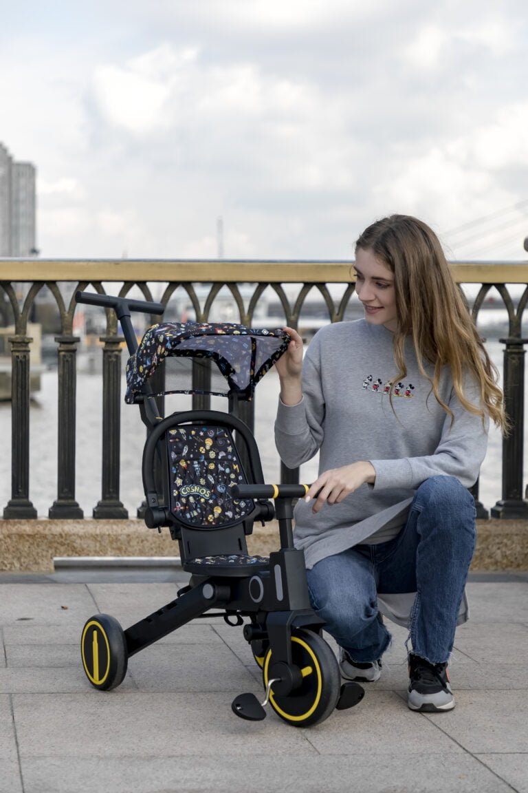 Newtronx tricycle with mom pushing child